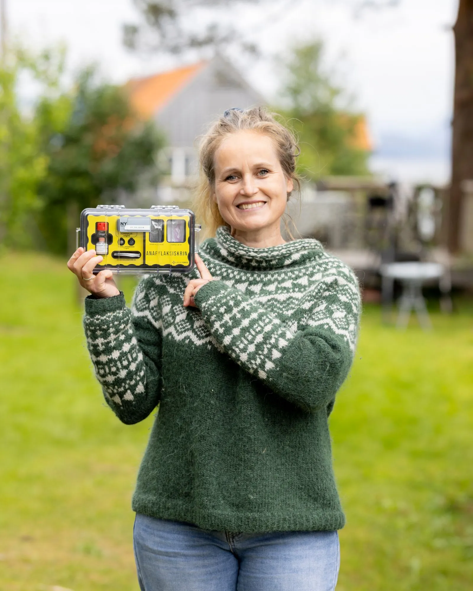 Kjersti Grinde, midwife and founder of EmendaKit, holding the anaphylaxis kit
